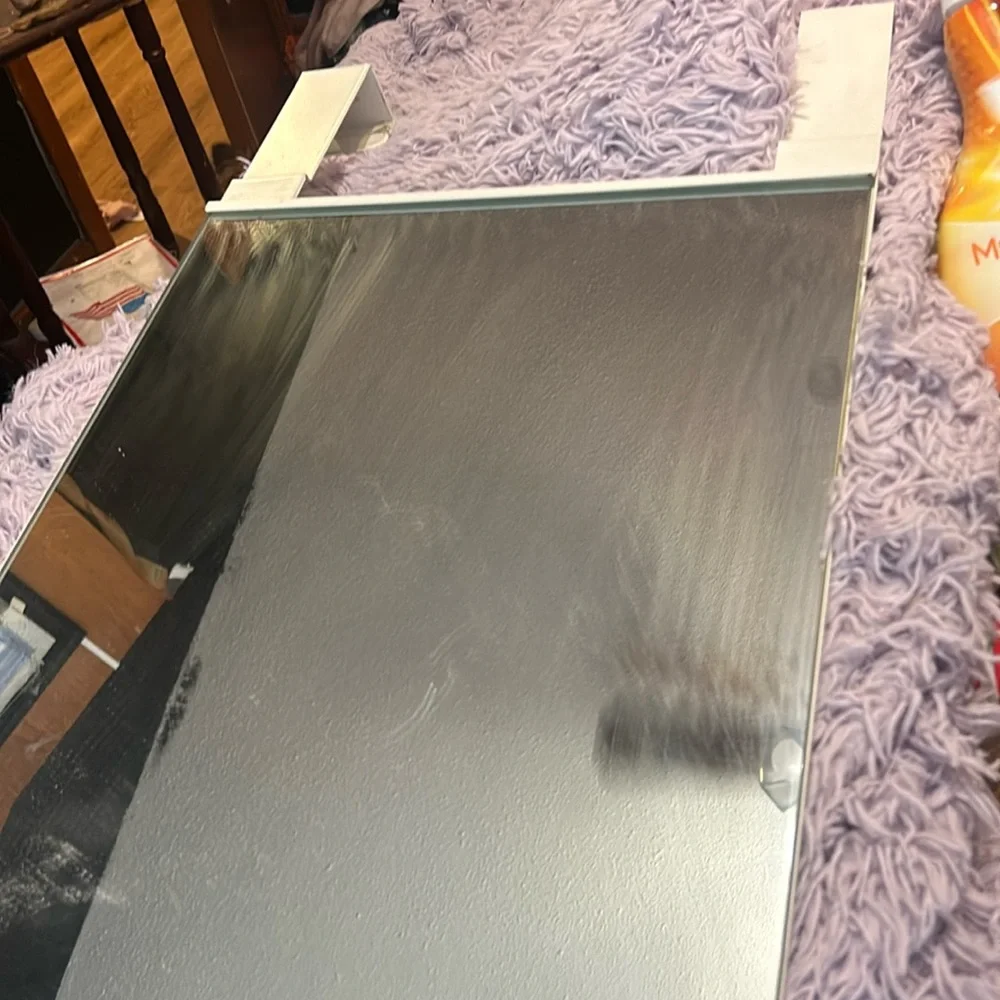 hanging door mirror, has some stains, easy to hang, medium size mirror